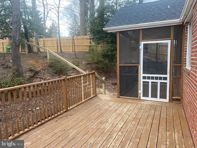 wooden terrace with a sunroom