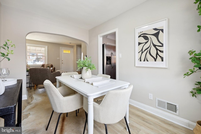 dining area with light hardwood / wood-style flooring