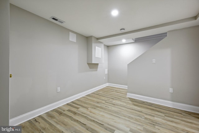 basement featuring light hardwood / wood-style flooring