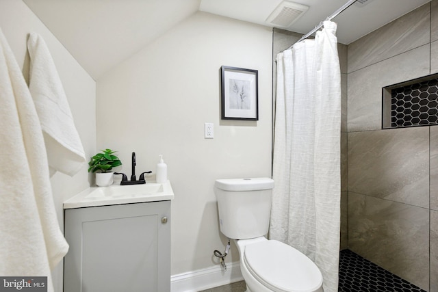 bathroom with toilet, vaulted ceiling, a shower with shower curtain, and vanity