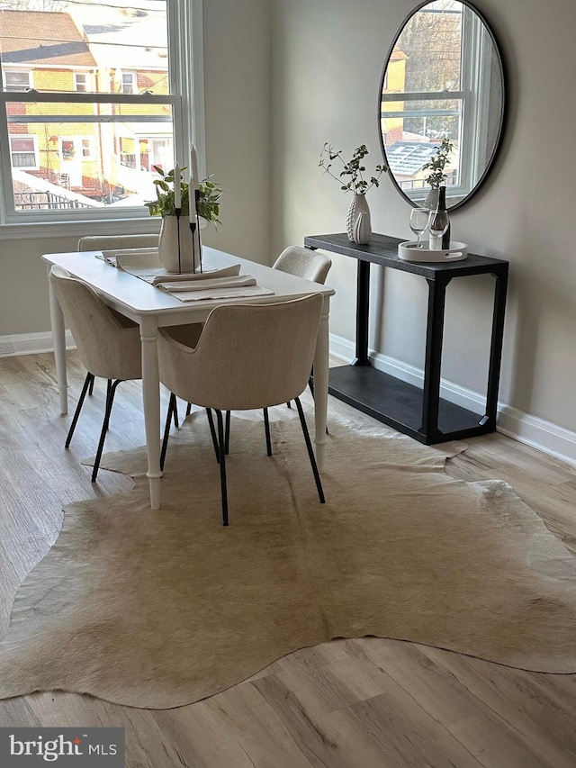 dining area with light hardwood / wood-style flooring