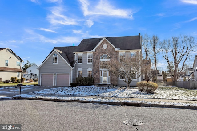 view of front of property with a garage