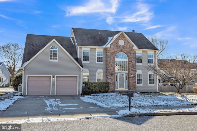 colonial home featuring a garage