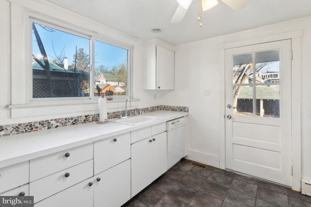 kitchen featuring white cabinetry, dishwasher, sink, and ceiling fan