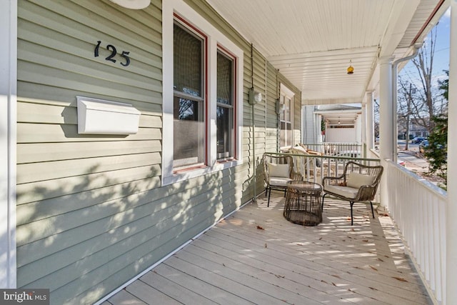 wooden deck with a porch