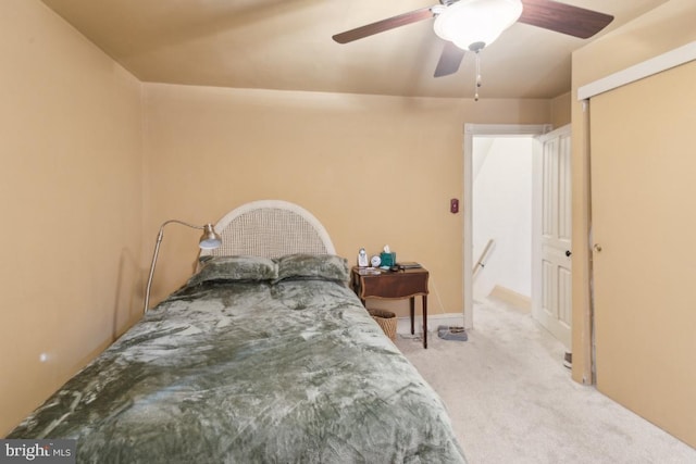 bedroom with ceiling fan and light carpet