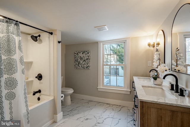 full bathroom featuring bathtub / shower combination, vanity, and toilet