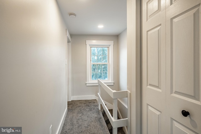 hallway with dark carpet