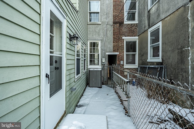 view of side of home featuring central AC unit