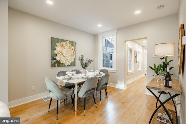 dining area featuring light wood-type flooring