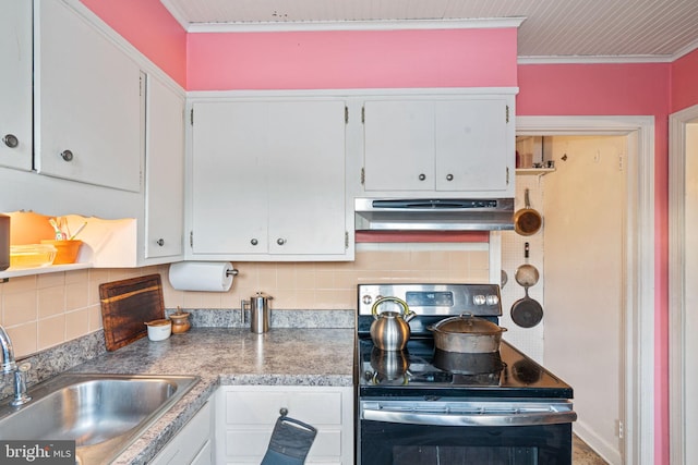 kitchen with tasteful backsplash, sink, ornamental molding, stainless steel range with electric stovetop, and white cabinets