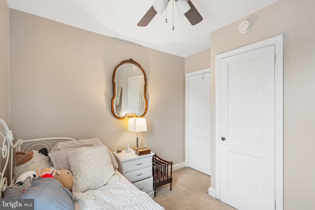 carpeted bedroom with ceiling fan