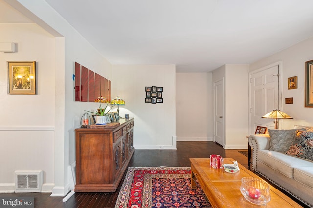 living room with dark hardwood / wood-style flooring