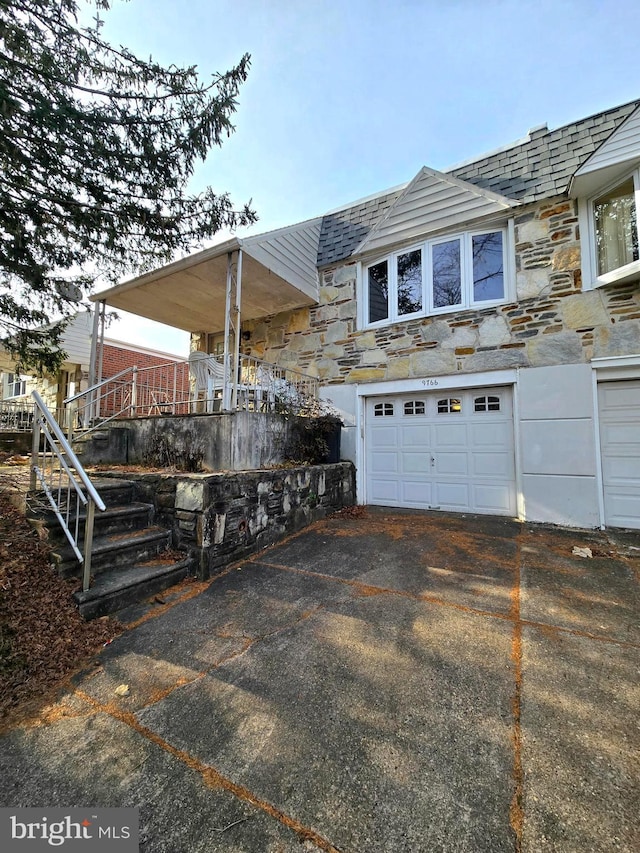 view of side of property featuring a garage