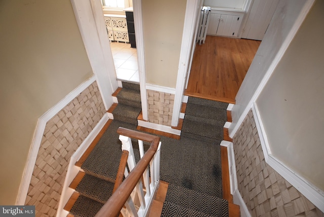 stairway with wood-type flooring