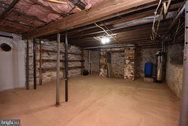 basement featuring water heater