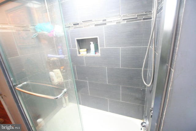 bathroom featuring an enclosed shower