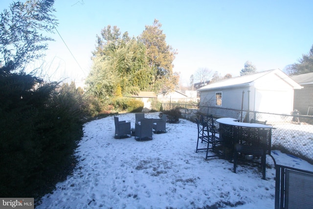 view of yard covered in snow