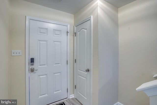 doorway with light wood-type flooring