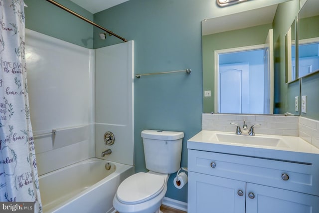 full bathroom with tasteful backsplash, vanity, shower / bathtub combination with curtain, and toilet