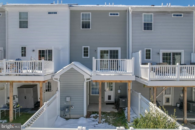 back of house with cooling unit