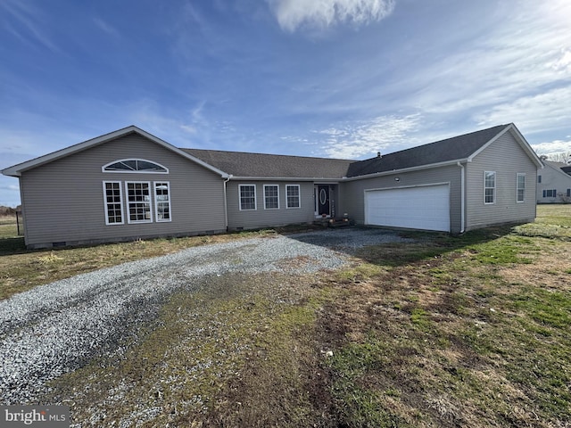 ranch-style house featuring a garage