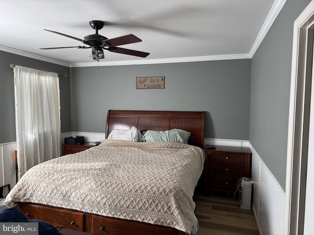 bedroom with ceiling fan, crown molding, and dark wood-type flooring