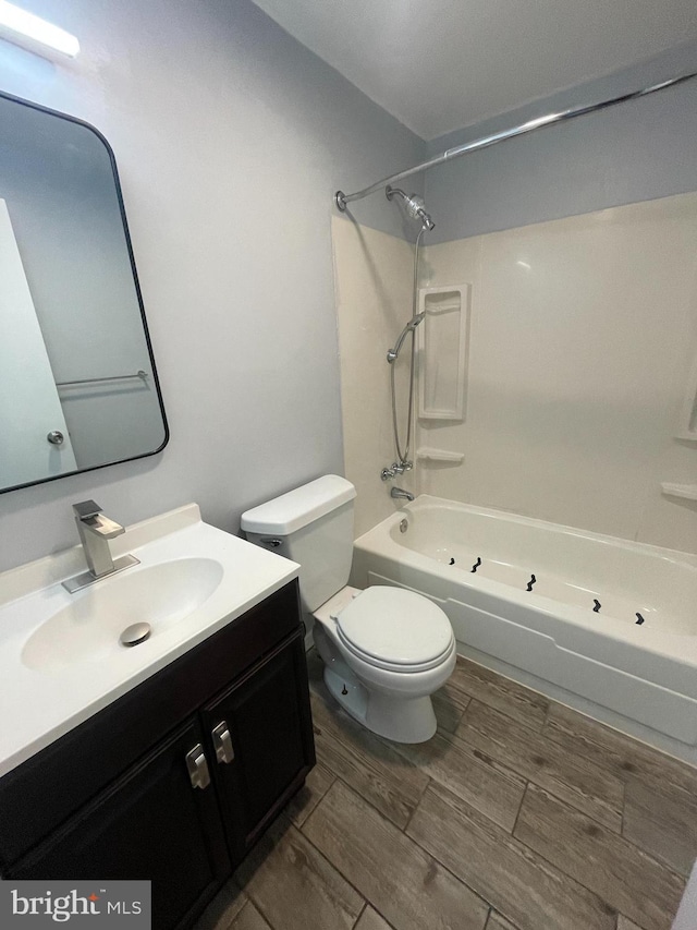 full bathroom with vanity, tub / shower combination, and toilet