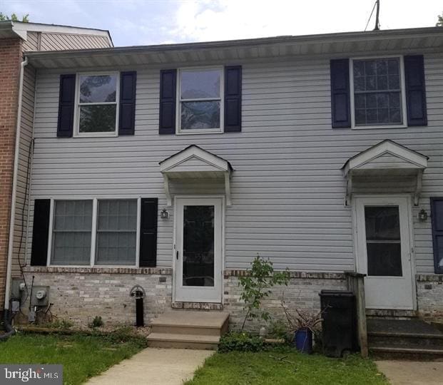 view of front of property with brick siding