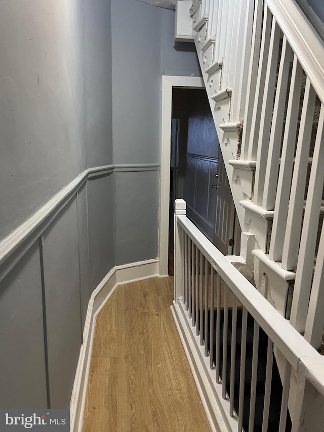 stairs with hardwood / wood-style floors