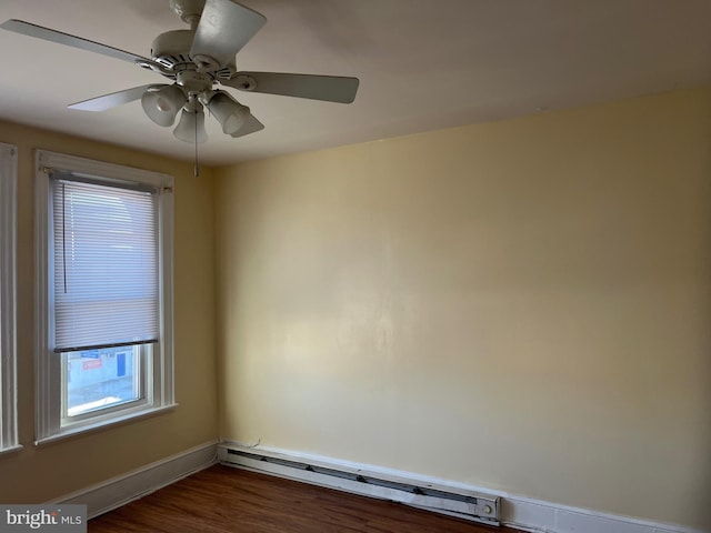 empty room featuring ceiling fan, dark wood-type flooring, and a baseboard radiator