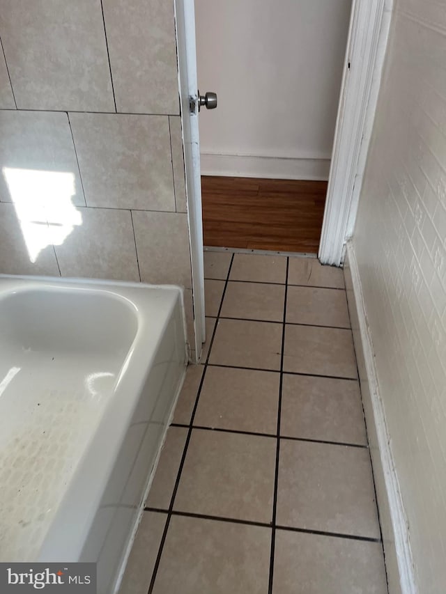 bathroom featuring tile patterned floors and a bathing tub