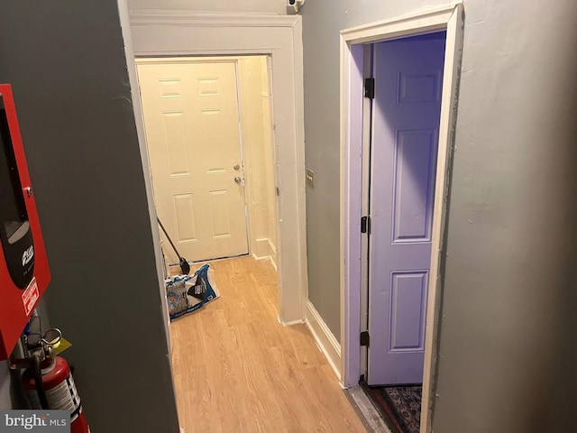 corridor with light wood-type flooring