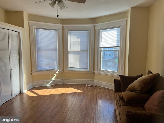 unfurnished room with ceiling fan and hardwood / wood-style floors