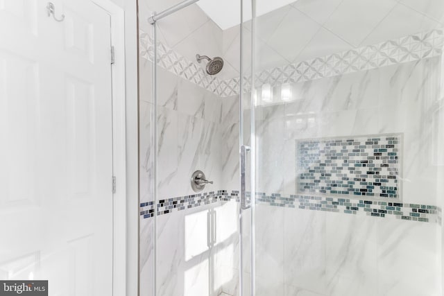 bathroom featuring an enclosed shower