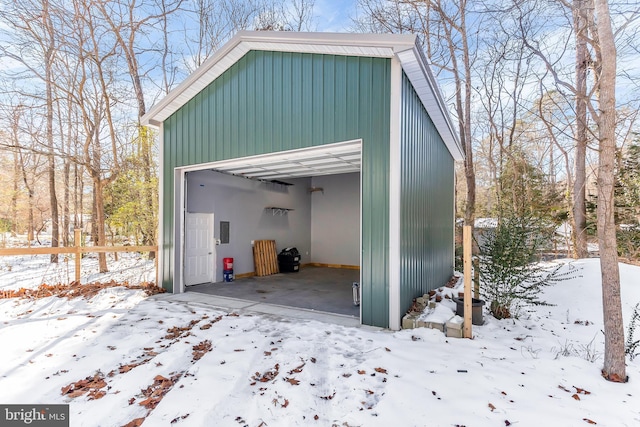 view of snow covered garage