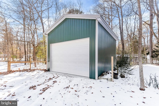 view of snow covered garage