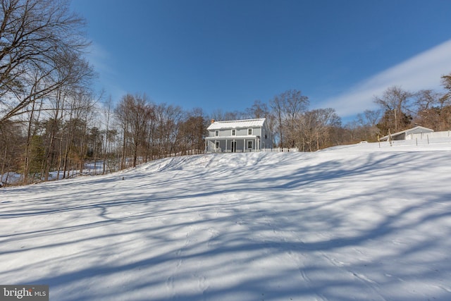 view of yard layered in snow