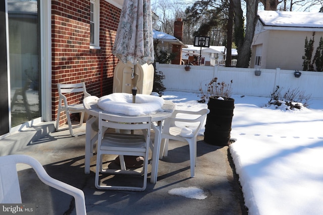 view of snow covered patio