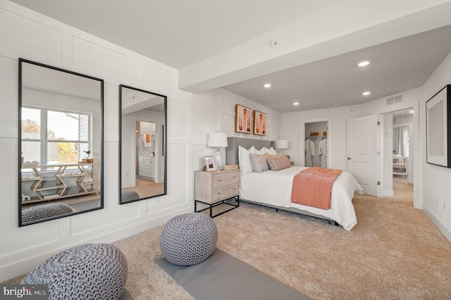 bedroom with carpet flooring and beam ceiling