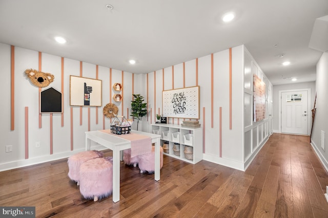 dining space featuring hardwood / wood-style flooring