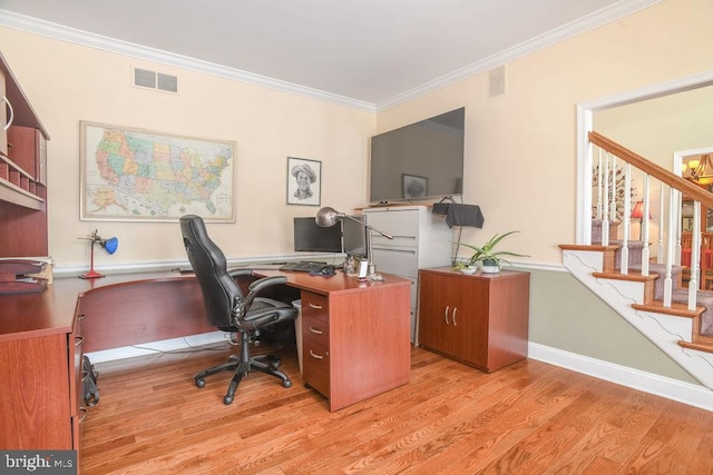 office space with light hardwood / wood-style floors and crown molding