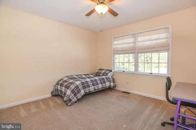 carpeted bedroom featuring ceiling fan