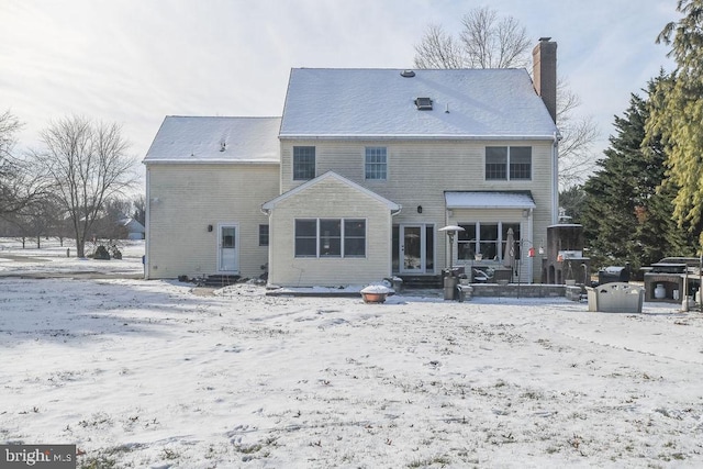 view of snow covered house