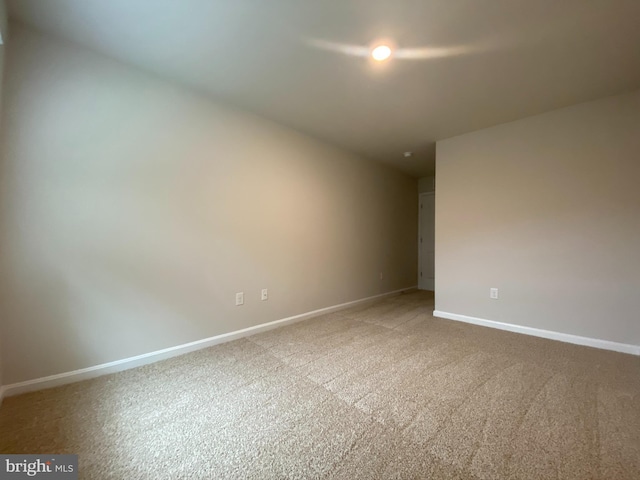 spare room featuring carpet flooring