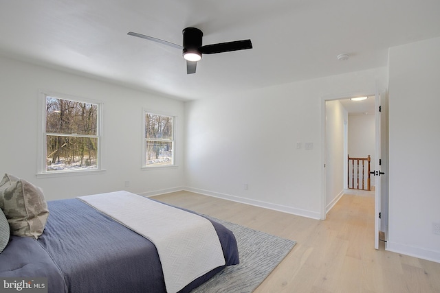 bedroom with ceiling fan and light hardwood / wood-style flooring