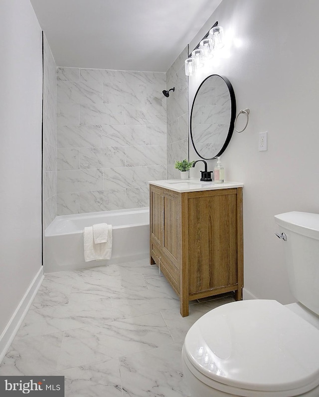 full bathroom with toilet, vanity, and tiled shower / bath