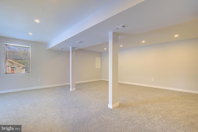 basement with light colored carpet