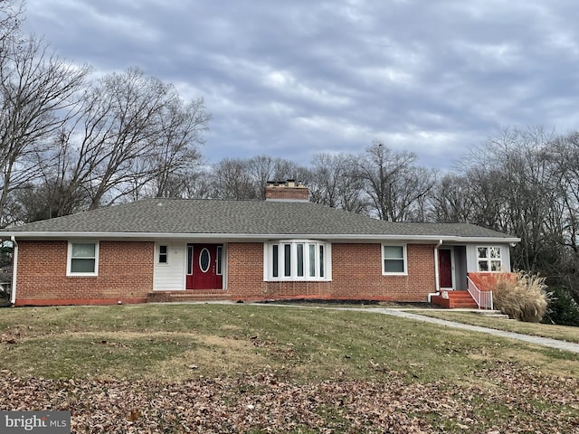 ranch-style home with a front lawn