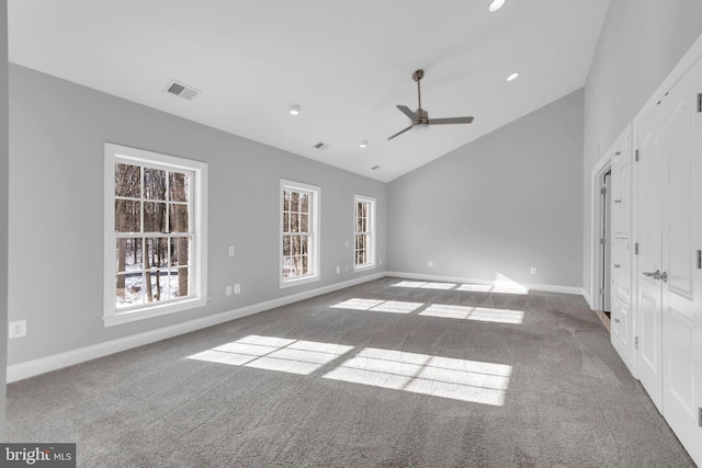 unfurnished bedroom with lofted ceiling, ceiling fan, and carpet floors